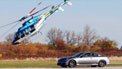 Infiniti G37 races helicopter