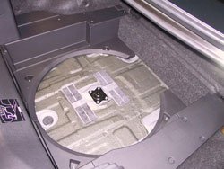 Spare tire kit for 2009 through 2012 Infiniti G37 convertibles expanded view of trunk base
